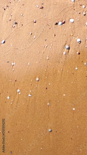 View of waves drying up on the beach