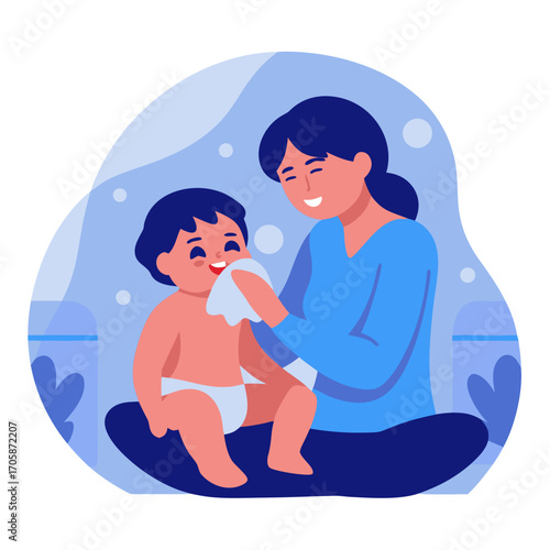 Asian mom wiping baby's mouth while sitting indoors with joy  