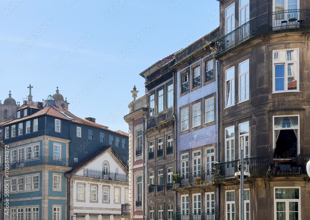 Fototapeta premium Traditional tiled facades and historic buildings in Porto, Portugal. Colorful architecture with