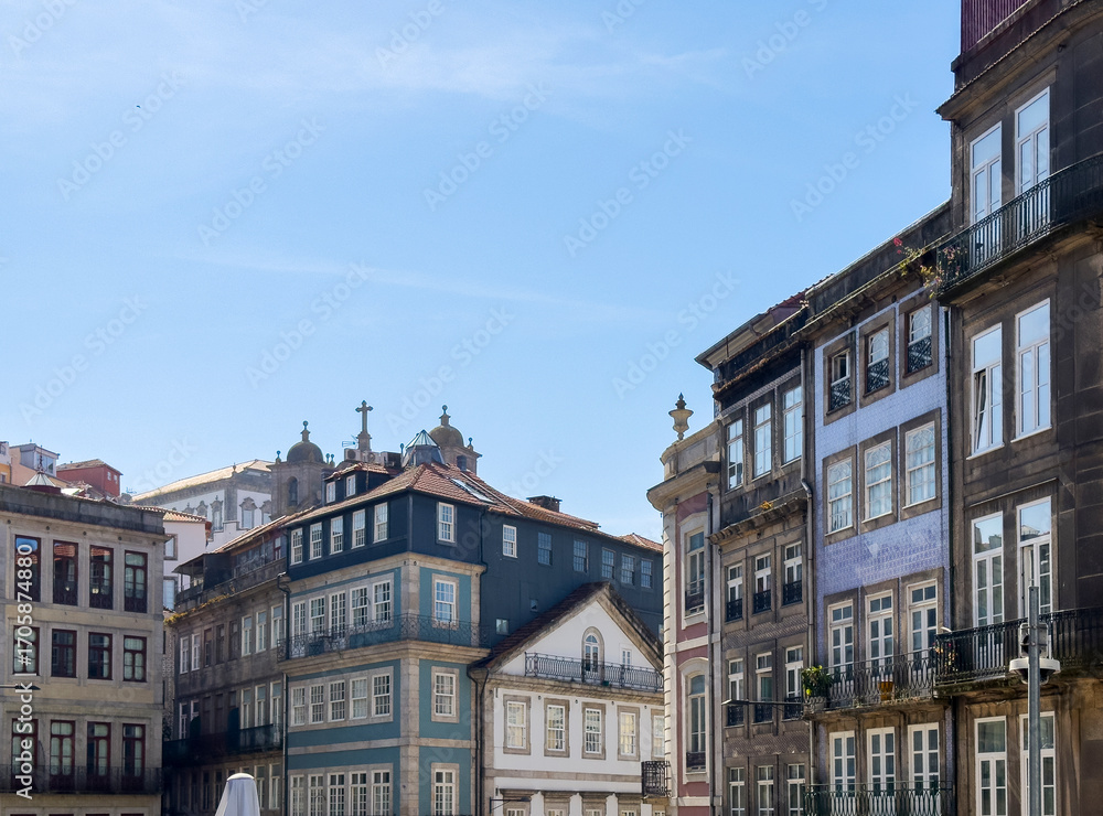 Obraz premium Historic facades with azulejo tiles and balconies in Porto, Portugal. Old town architecture with