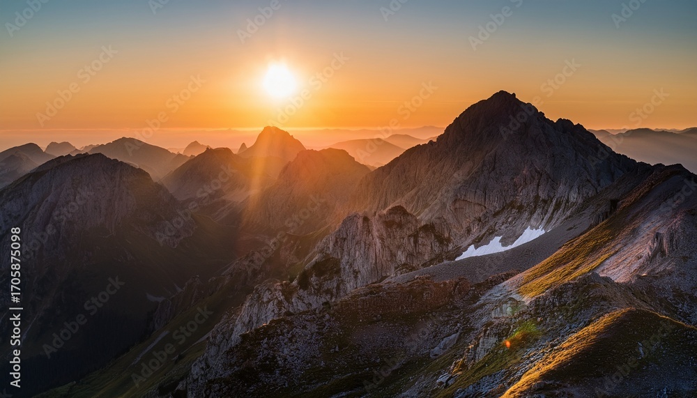 Naklejka premium A Mountain Range With A Sun Setting Behind It