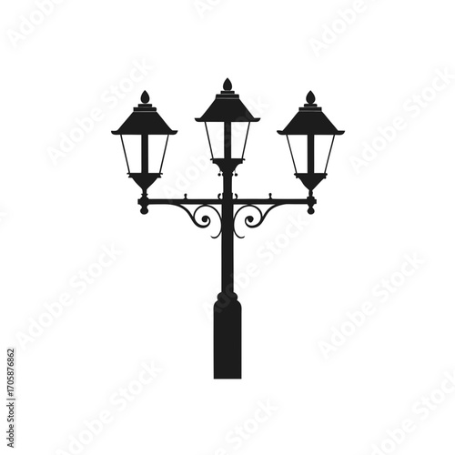 Elegant black silhouette of a three light victorian street lamp