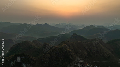 Slika na platnu Dawn on the high mountain peaks of Ha Lang area, with pack horses and people going to work