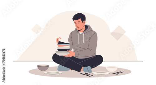 Young Man Arranging Plates, Bowls, and Cutlery in Preparation for a Meal