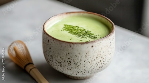 Delicious matcha latte in a rustic bowl, vibrant green color, cozy vibe, perfect for health-conscious relaxation or mindfulness.