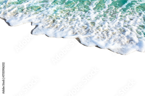 Aerial view of ocean waves crashing on shore, creating foamy texture. water appears turquoise and vibrant
