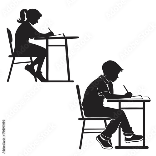 Young students are learning together, sitting at desks and writing their lessons down on paper