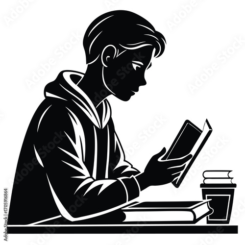Young person with hoodie carefully reads a book sitting by the table is isolated