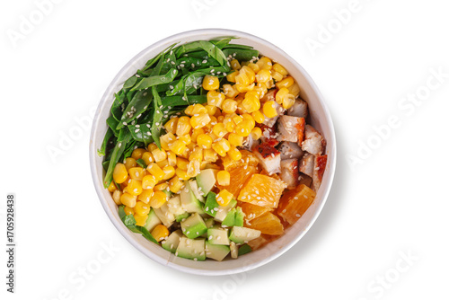 Bright poke bowl with juicy chicken pieces, fresh avocado, sweet corn, orange slices and greens, topped with sesame seeds, served in eco paper bowl, top view