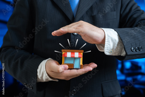 Foto A man holds a small shop in his hands