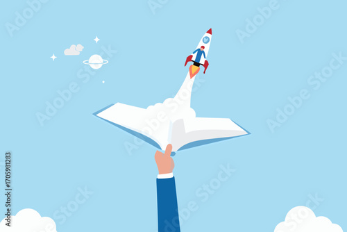 A businessman launches a rocket from an open book symbolizing education and innovation in space exploration