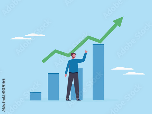 Man standing on a bar chart reaching for an upward trending green arrow representing growth and success
