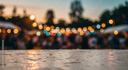 Blurred Gathering at Outdoor Event with Bokeh Lights at Twilight