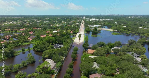 Hurricane Debby tropical rainstorm flooded residential homes in suburban community in Sarasota, Florida. Aftermath of natural disaster