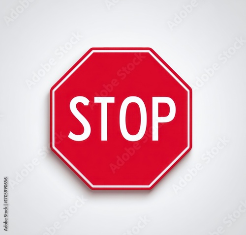 Red octagonal sign with a white border and the word 