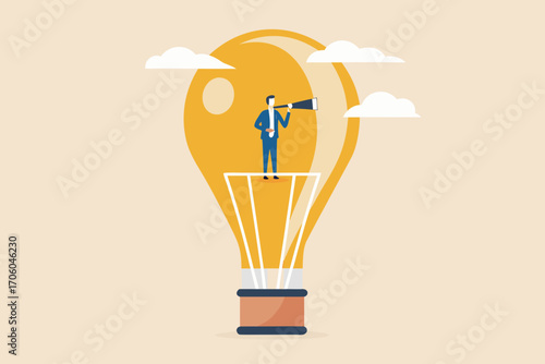 Businessman with spyglass standing inside a glowing light bulb looking towards the future