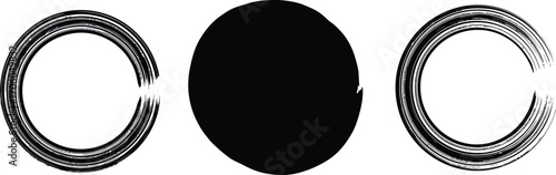three circular shapes with intricate patterns and a solid black center
