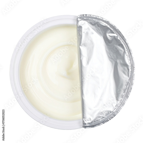 Round white container of creamy dairy product, top view, foil lid open