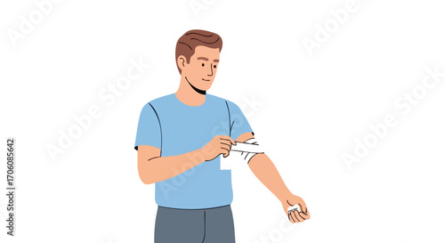 Young man in a blue tshirt applying a white medical bandage to his injured forearm.