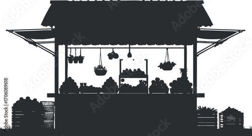 Silhouette of a market stand showcasing fresh fruits and vegetables in an outdoor setting.