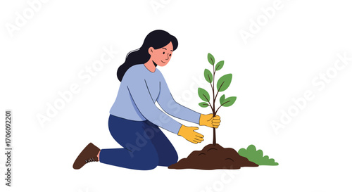 Young woman with long dark hair kneeling to plant a small tree sapling in the soil.