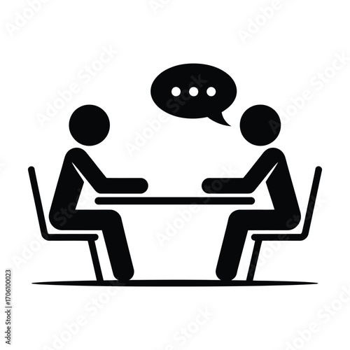 Black and white icon of two people in conversation at a table, symbolizing communication, dialogue, interview, and interpersonal exchange