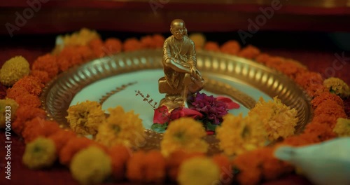 Wallpaper Mural Devotees performing Sai Baba’s puja with a small brass idol, lighting lamps, and offering fresh flowers, creating a serene and devotional atmosphere filled with faith and positive energy Torontodigital.ca