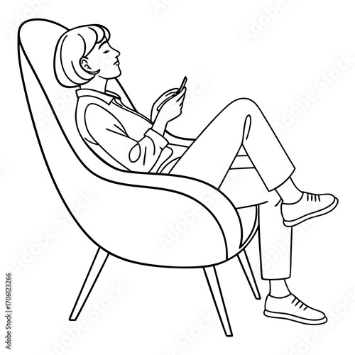 Woman relaxing in a modern chair, engrossed in her phone, enjoying leisure time in a comfortable setting