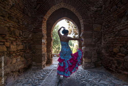 Woman in flamenco dress at Andalusian garden
