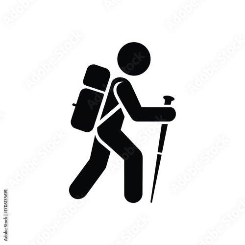 Silhouette of a hiker with backpack and trekking pole