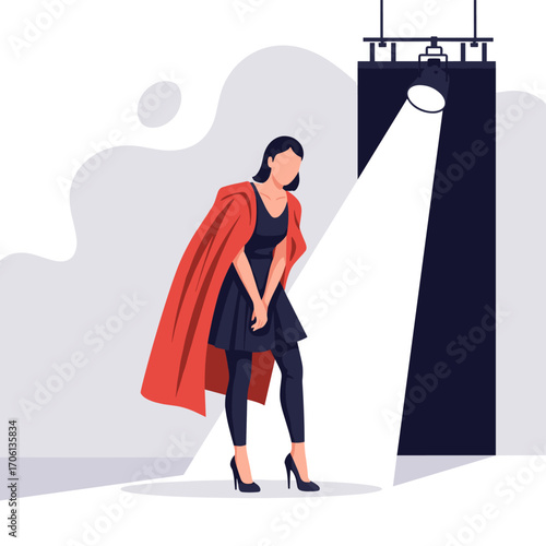 Woman in Spotlight on Stage with Red Cape.