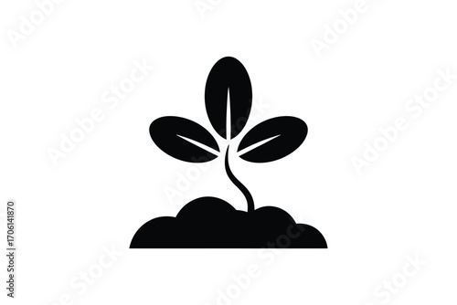 Black silhouette of a young plant sprouting from soil