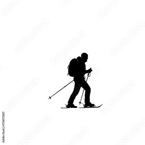Silhouette of a solo hiker with a backpack and poles walking across a snowy landscape