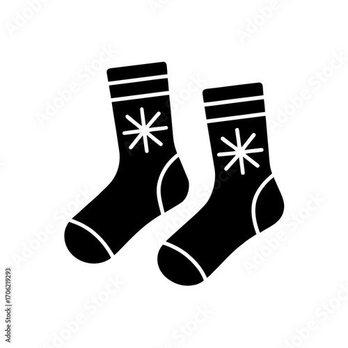 Pair of wintery socks on transparent background silhouette