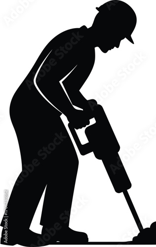Construction worker silhouette operating a jackhammer in black and white