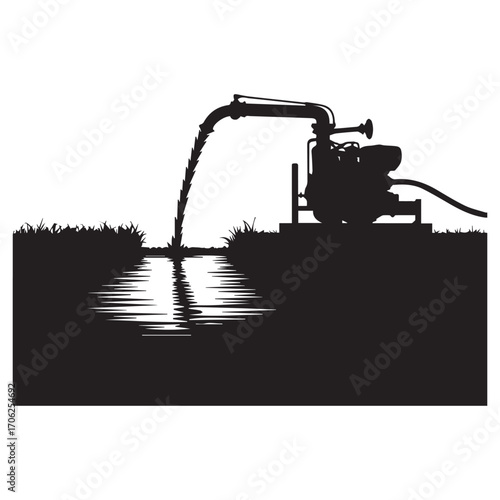 Silhouette of a powerful water pump transferring liquid from a body of water to a field