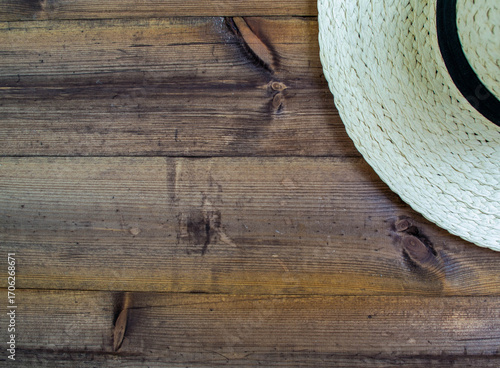 Summer vacation, flatlay. Hat on a dark wooden background.
