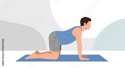 Man In Yoga Pose On A Blue Mat Demonstrating Cat Cow Stretch For Flexibility And Fitness