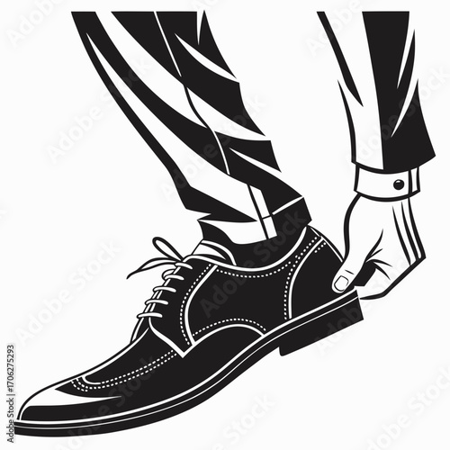 Close up of a man s hand adjusting the fit of a classic black leather oxford shoe with laces on his foot wearing formal trousers