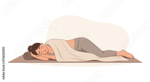 Relaxed Woman Lies Peacefully on Yoga Mat, Wrapped in a Soft Blanket