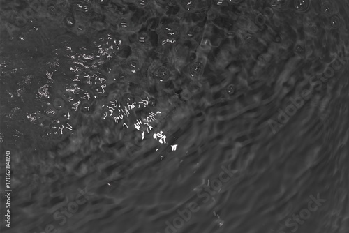 Black water with soft ripples. black water sea wave background. Black water texture with light reflexion