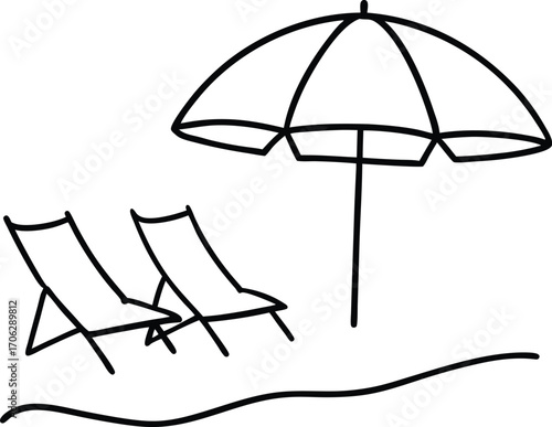 Beach chairs and umbrella on a sandy shore, perfect for relaxation and vacation