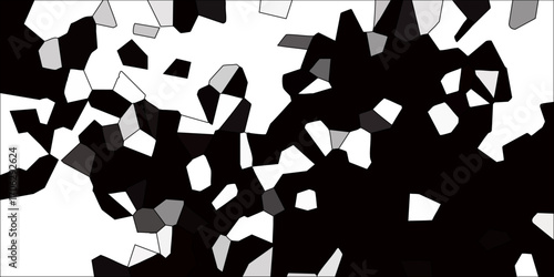 Abstract geometric mosaic pattern with irregular polygons in black white and grey tones creating a dynamic fractured background texture for design