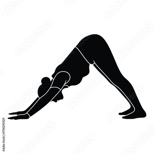 Silhouette of woman performing downward-facing dog yoga pose for wellness and flexibility silhouette