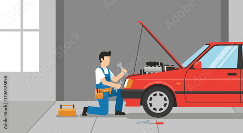 Mechanic kneeling repairing a red car with open hood in a garage setting scene