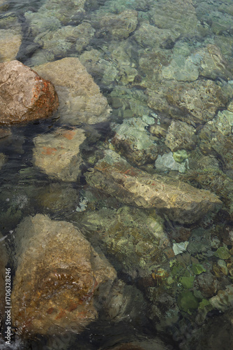 Large stones in the Adriatic sea with turquoise water