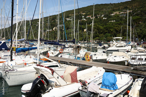 Yacht mooring in the harbor, yacht club harbor in Triet, Italy. Beautiful yachts against the blue sky