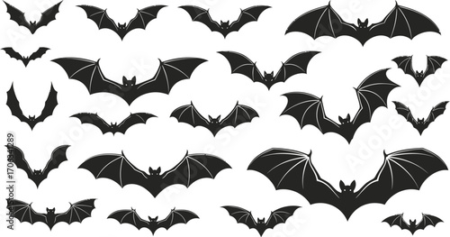 Silhouetted bats in various flying positions on a white background for halloween