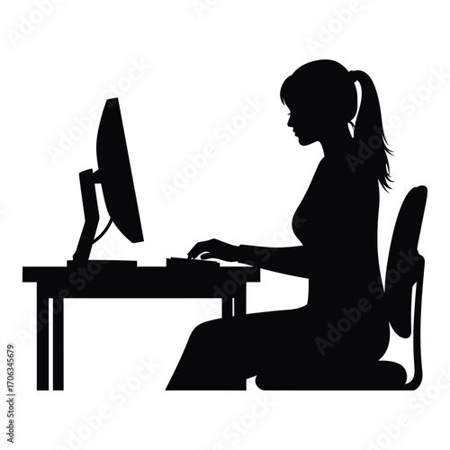Silhouette of woman typing on computer keyboard at desk silhouette