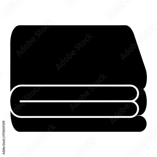 Neatly folded stack of black towels, ready for use or storage